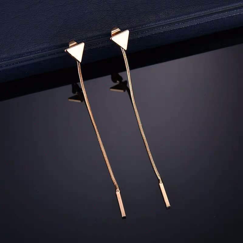 Back detail of earring hook and tassel attachment point
