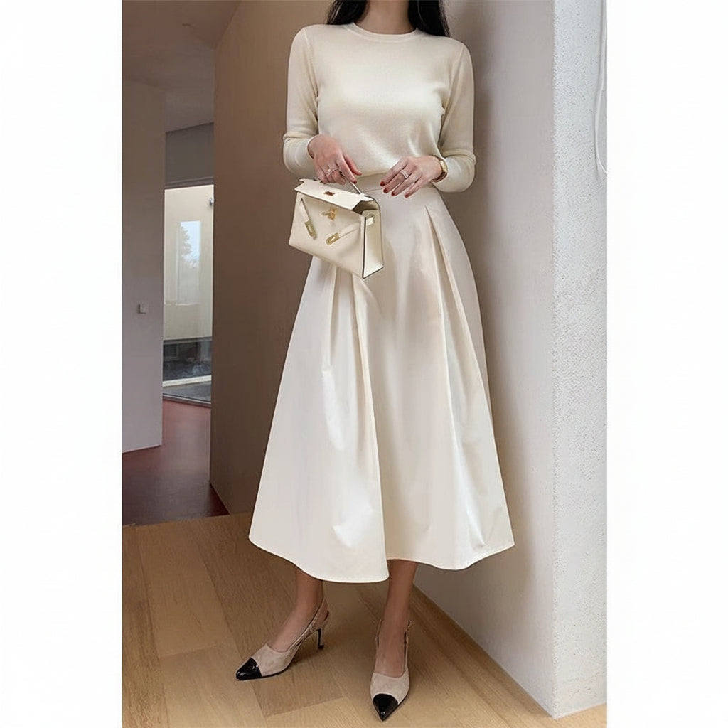 Back view of black high-waist A-line skirt showing length and fit