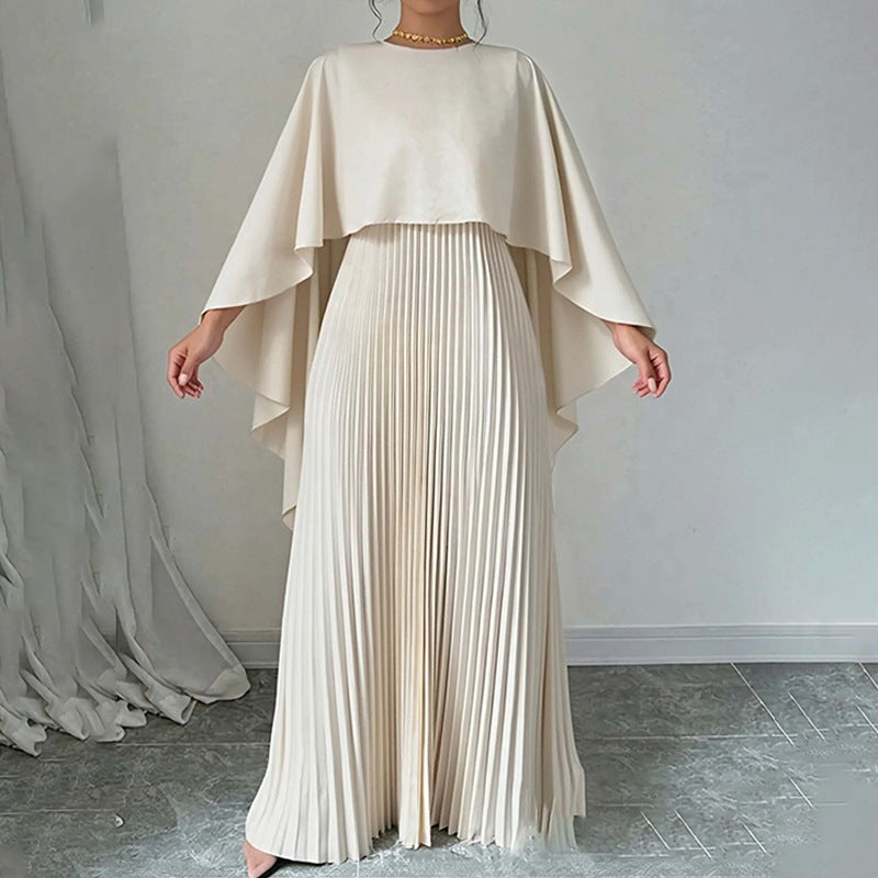 Side profile of dress silhouette highlighting floor-length hem and sleeve flow