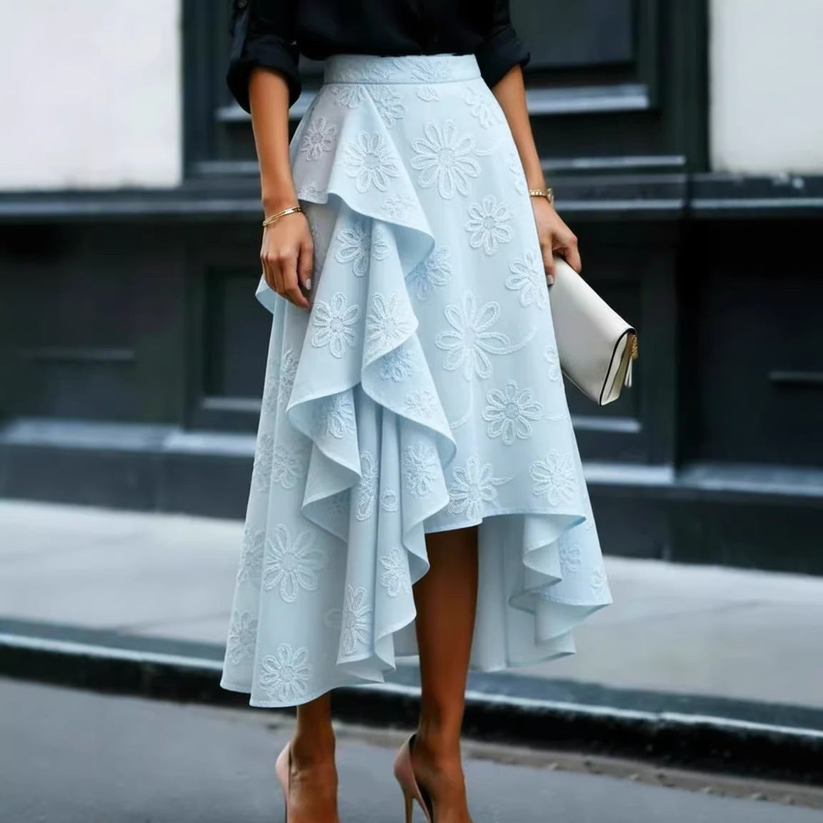 Side profile displaying midi length and flowing wave-hem silhouette