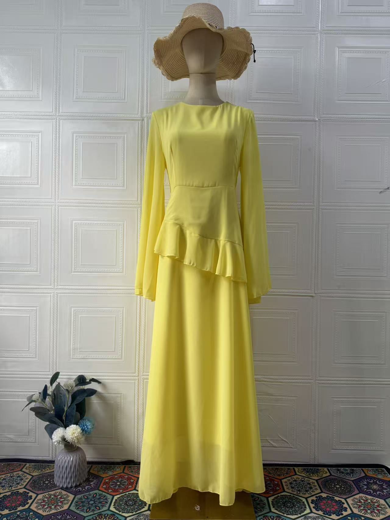 Model wearing complete dress ensemble displaying overall elegant appearance and fit