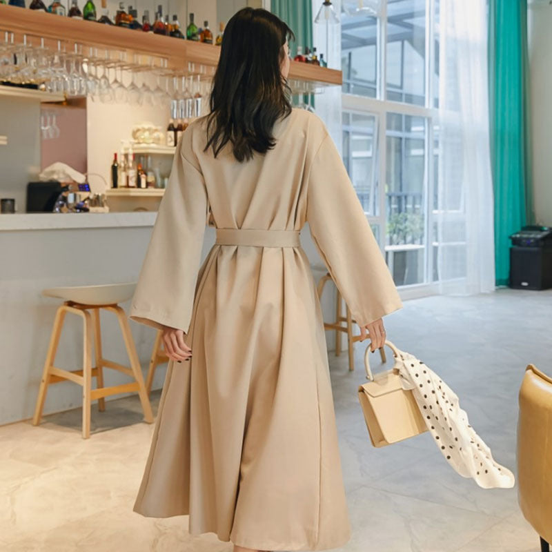 Back view showing elegant draping and full-length skirt with modest coverage