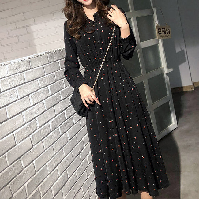 Side profile of A-line chiffon dress demonstrating graceful drape and sleeve length