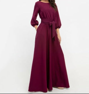 Full-length front view of A-line modest maxi dress in burgundy with long sleeves
