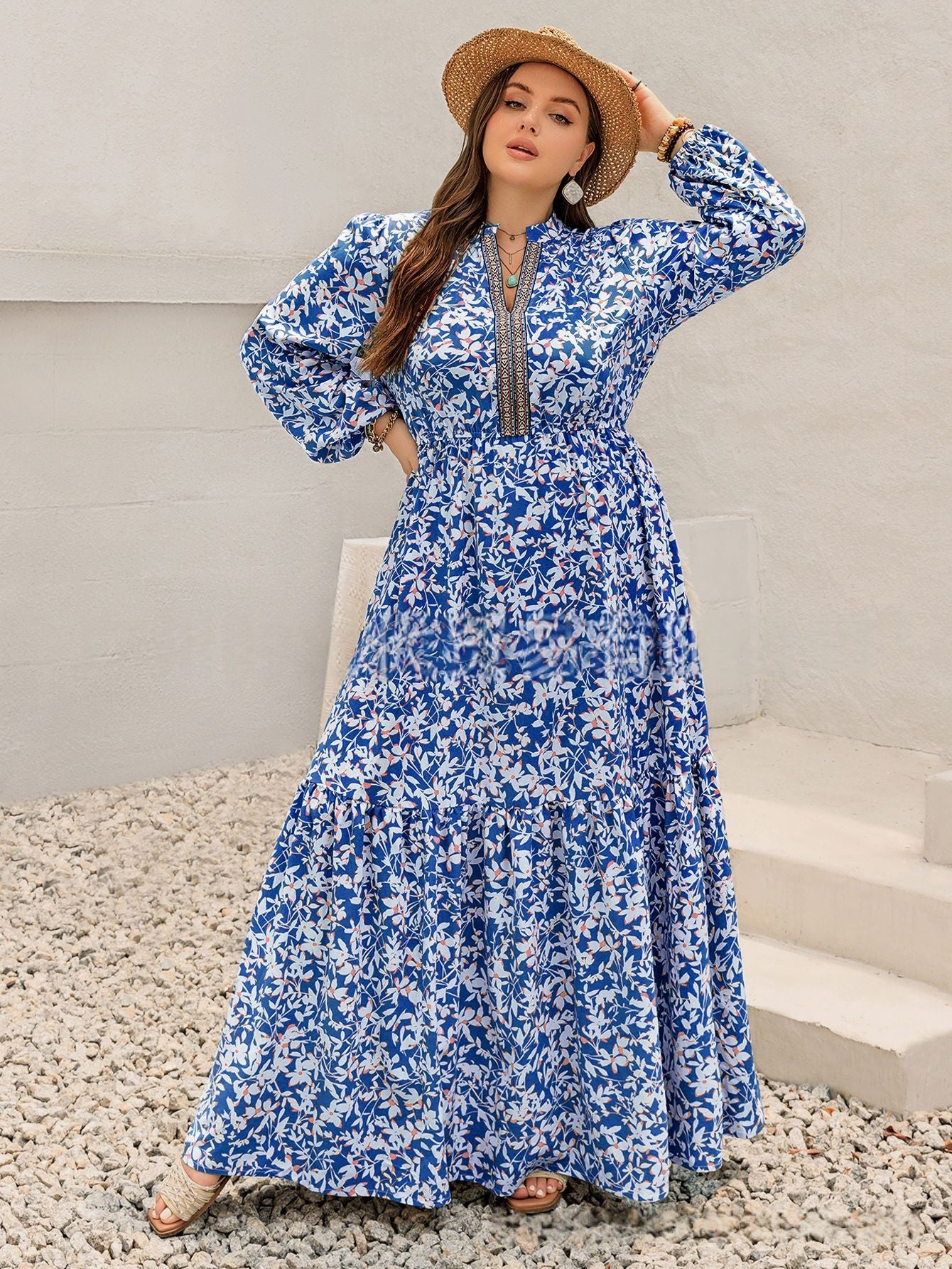 Back view of the dress showing the V-neckline and embroidered waistband