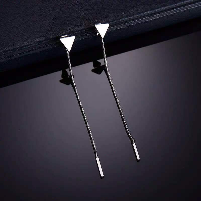 Side profile view of earring displaying length and tassel drape