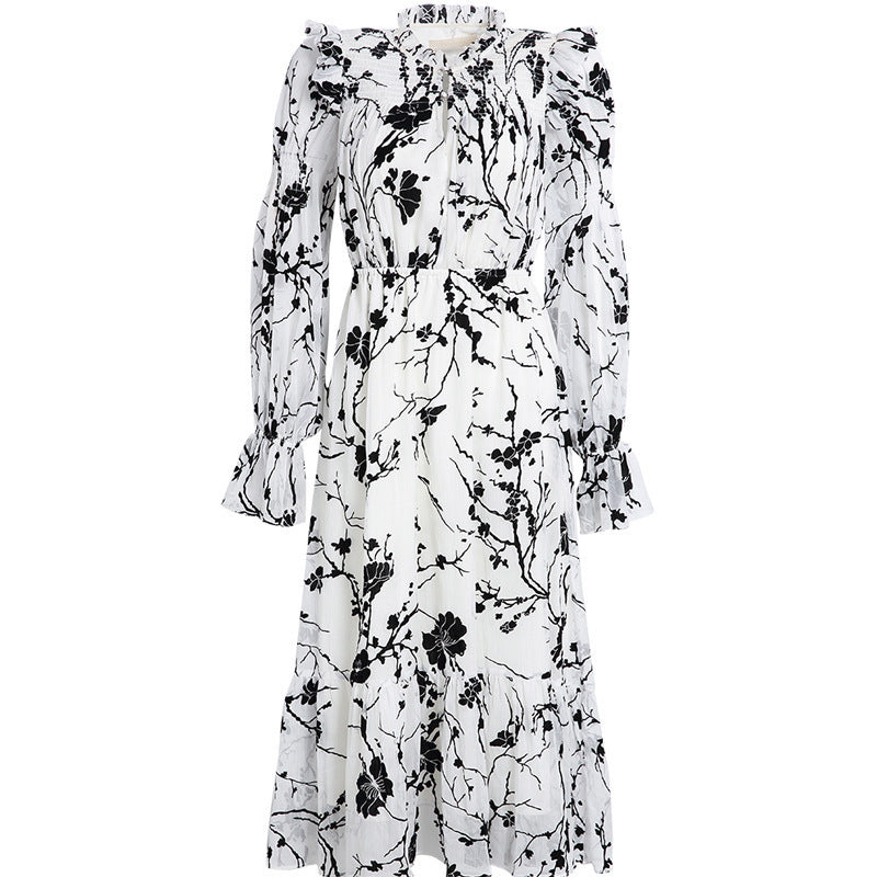 Back view of long-sleeved floral maxi dress showing ruffled skirt