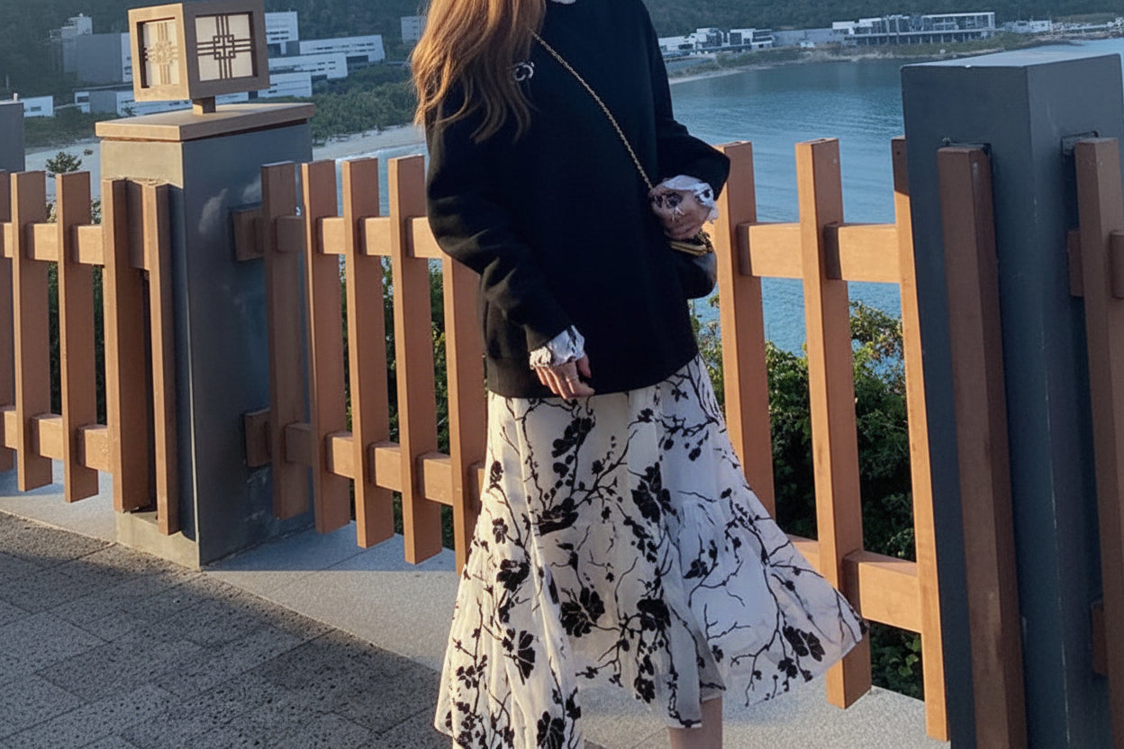 Side profile of flowing chiffon maxi skirt with tiered ruffles