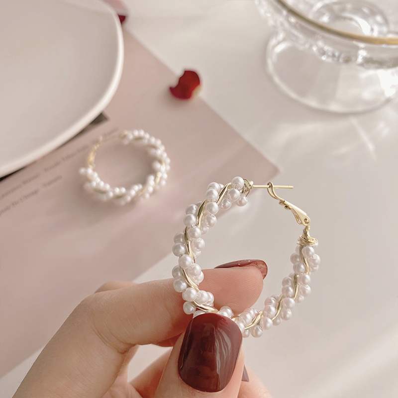 Front-facing angle displaying the symmetrical pearl round hoops, versatile accessory for modest styling