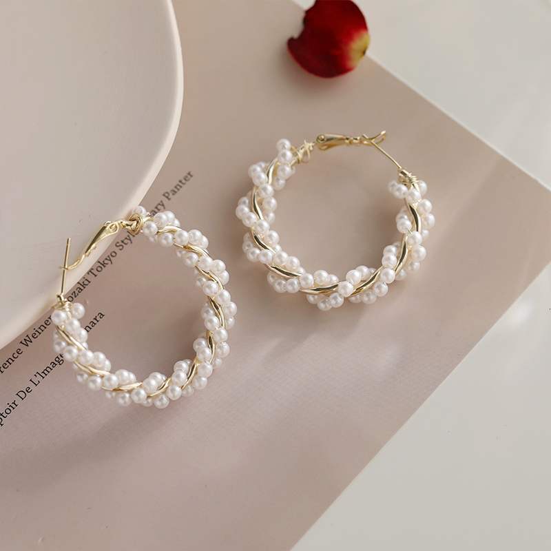 Side profile view showcasing the dimensional pearl circle hoop earring silhouette and lightweight construction