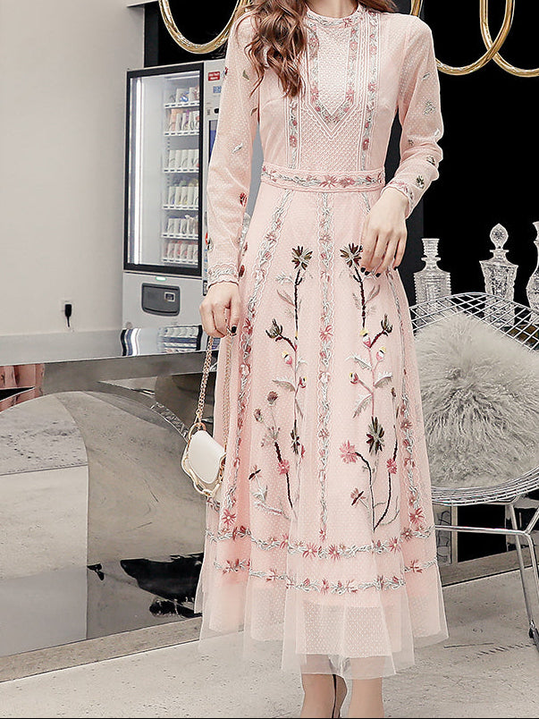 Side profile of dress highlighting elegant draping and embroidered sleeve details