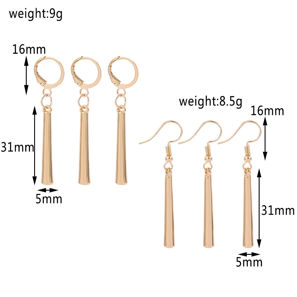 Close-up view of gold earring clasp and attachment mechanism detail