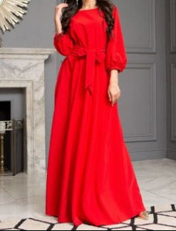 Hem and floor-length detail of burgundy modest maxi dress skirt