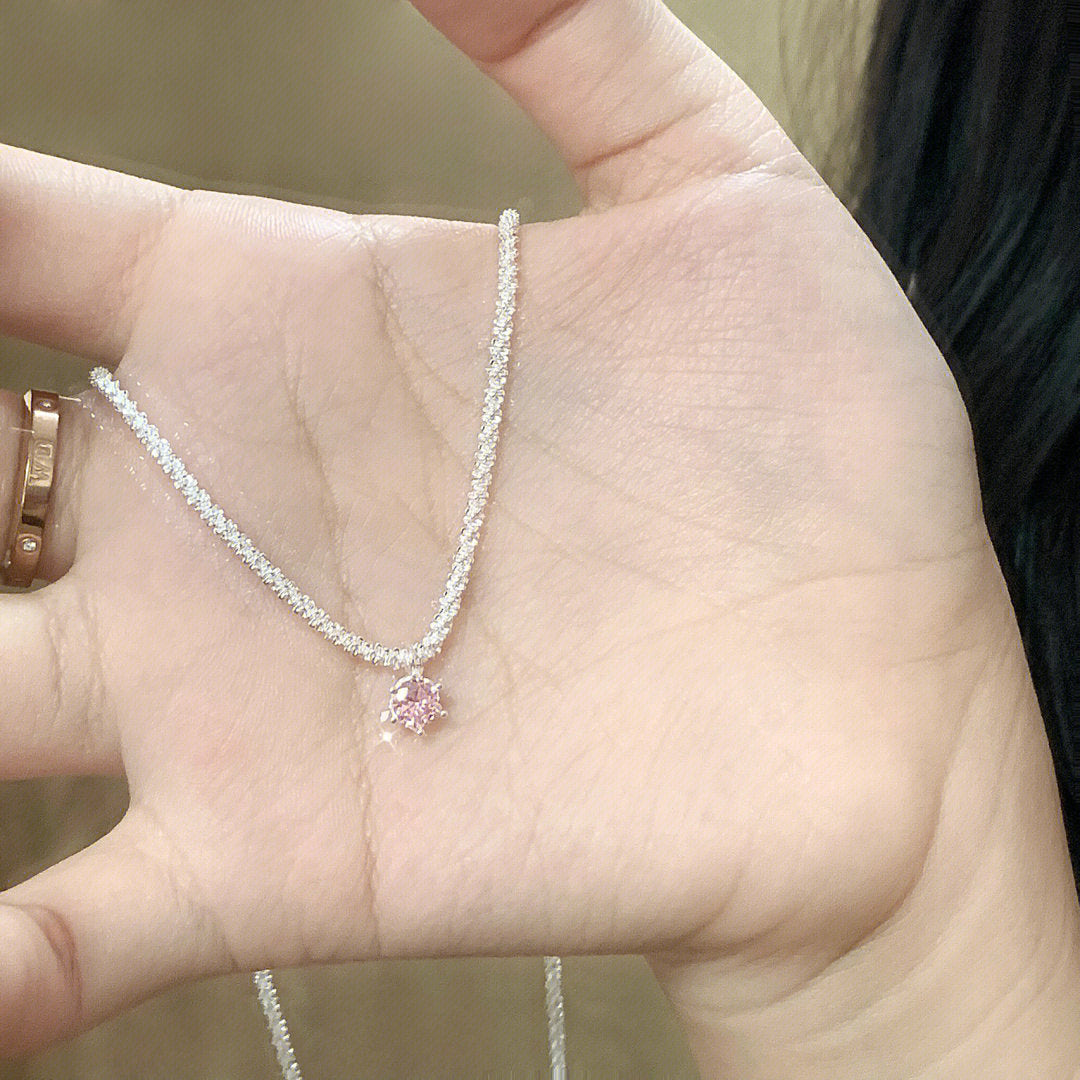 Necklace worn layered with other pieces showing styling versatility options