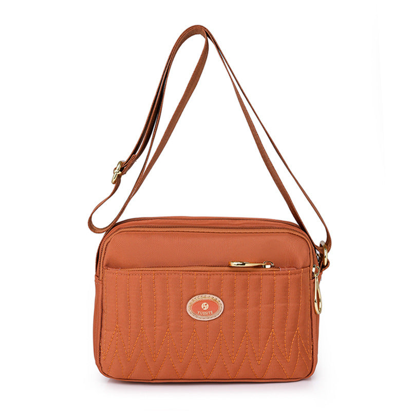 Angled view showing how bag sits when worn across body