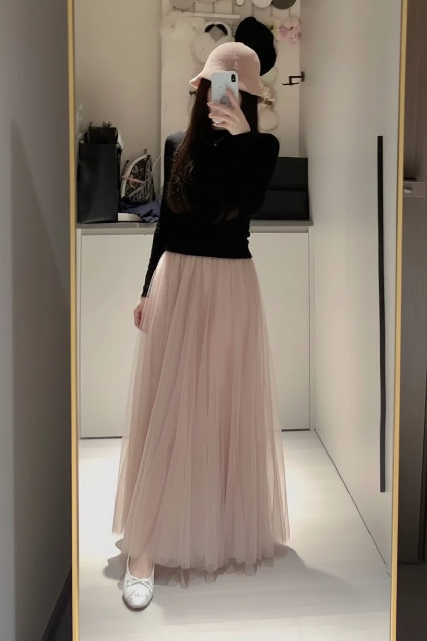 Close-up detail of waistband and pleating on high-waist midi skirt