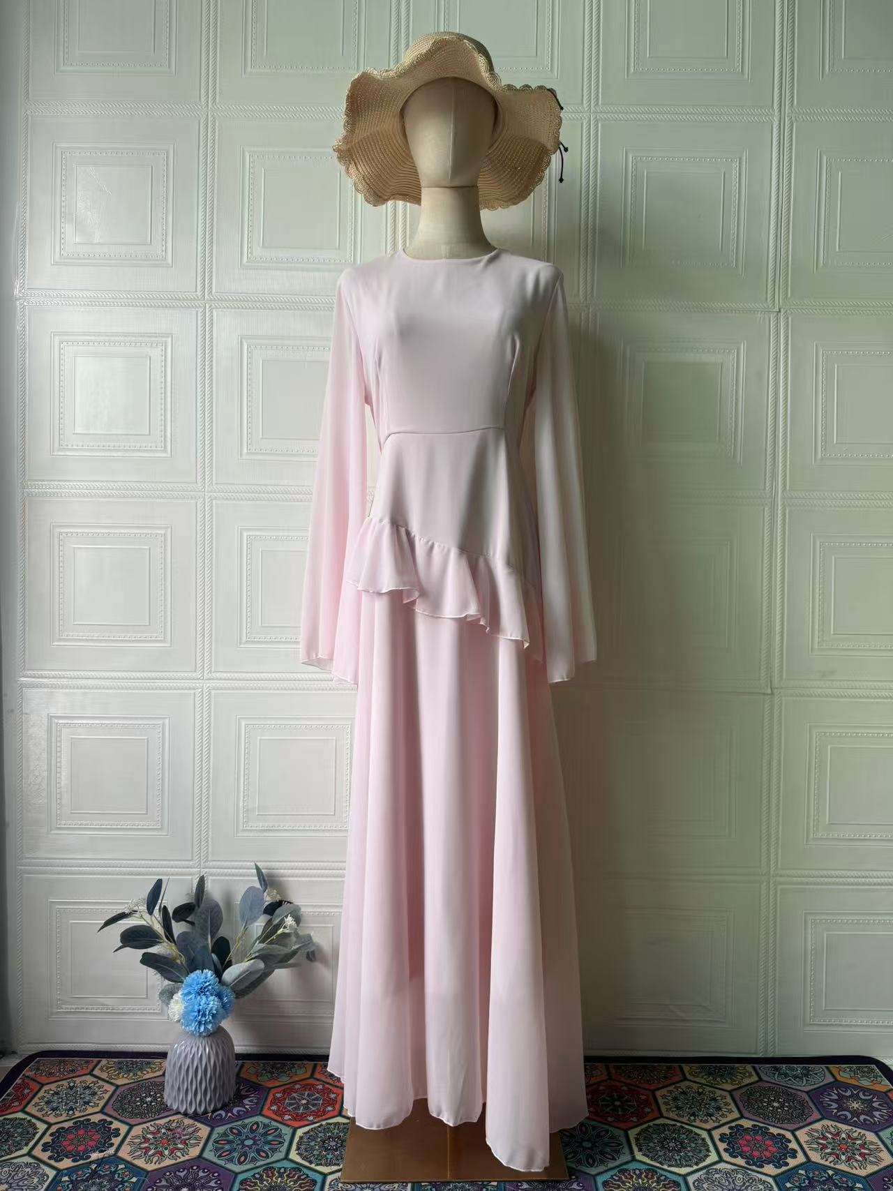 Three-quarter view showing the dress worn with modest styling