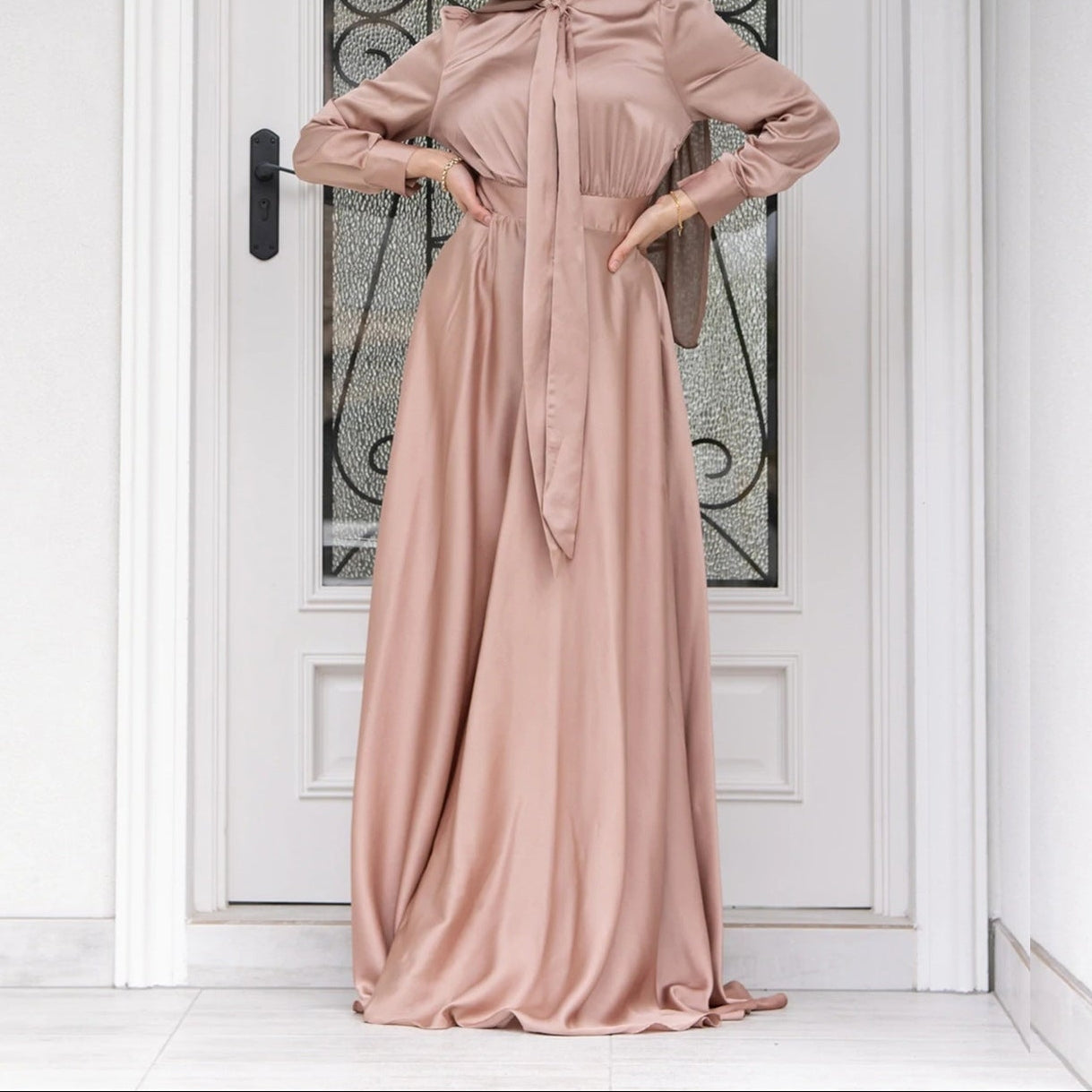 Front view of modest dress showing full-length design with long sleeves and fitted waist