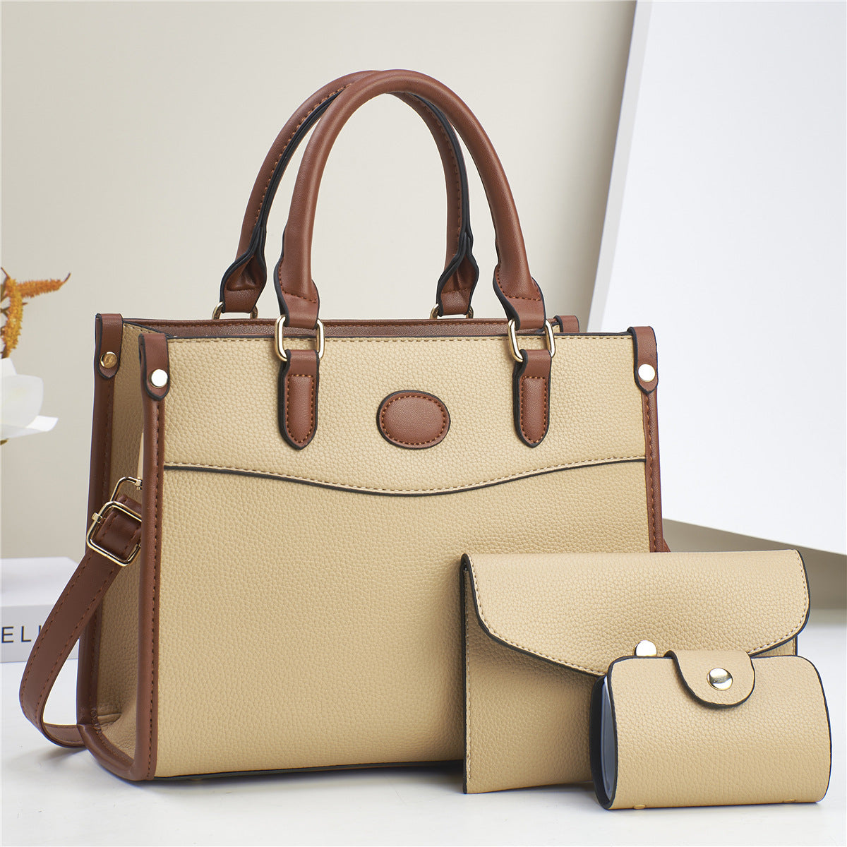 Side profile of shoulder bag set displaying depth and bag dimensions