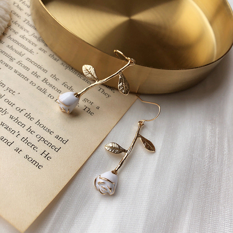 Overhead flat lay perspective displaying pair of matching floral drop earrings
