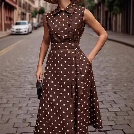Side profile displaying dress drape and retro polka-dot collar design