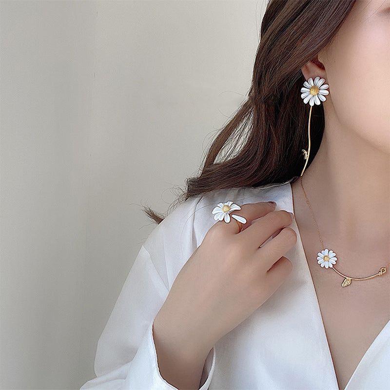 Stylish unique floral earrings in gold tone with delicate flower design details