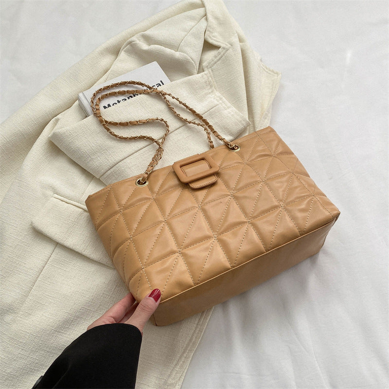 Bottom view showing feet and base structure of black chain bag