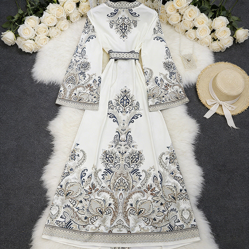 Back view of midi dress showing flowing silhouette and print design