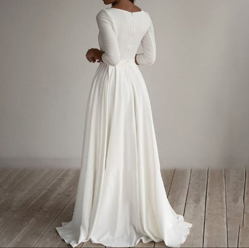 Back view of long white evening dress showing elegant draping