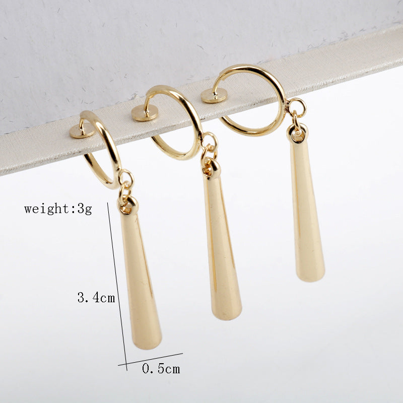 Three-quarter angle view of gold drop earring shape