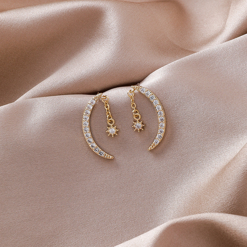 Side profile view showing elegant curved silhouette of zircon moon earrings