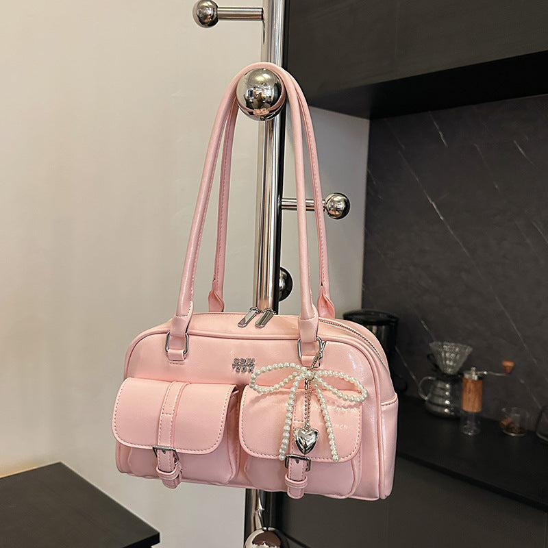 Angled view showing how bag sits on shoulder when worn