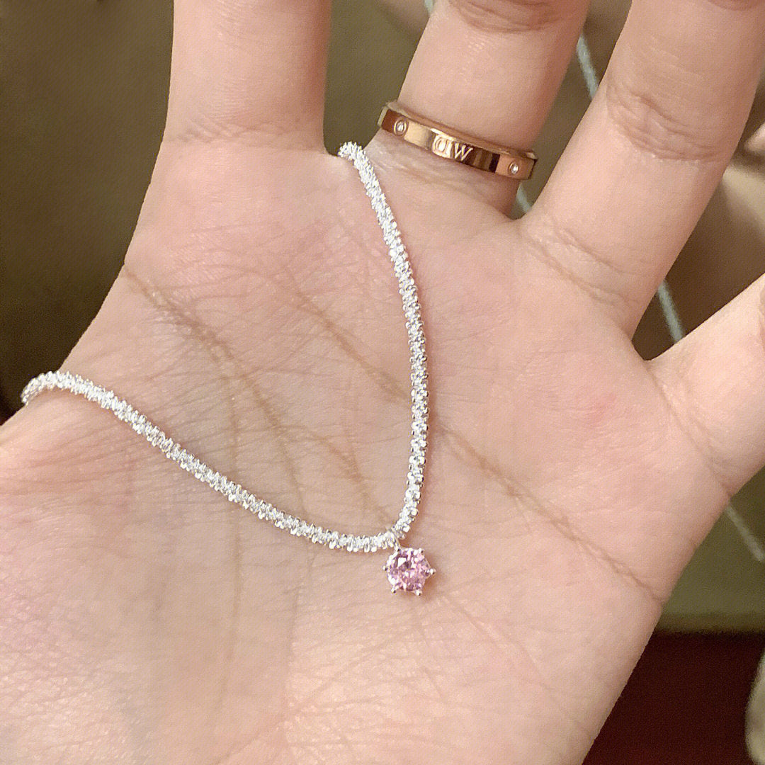 Overhead flat lay of complete necklace showing full length and design