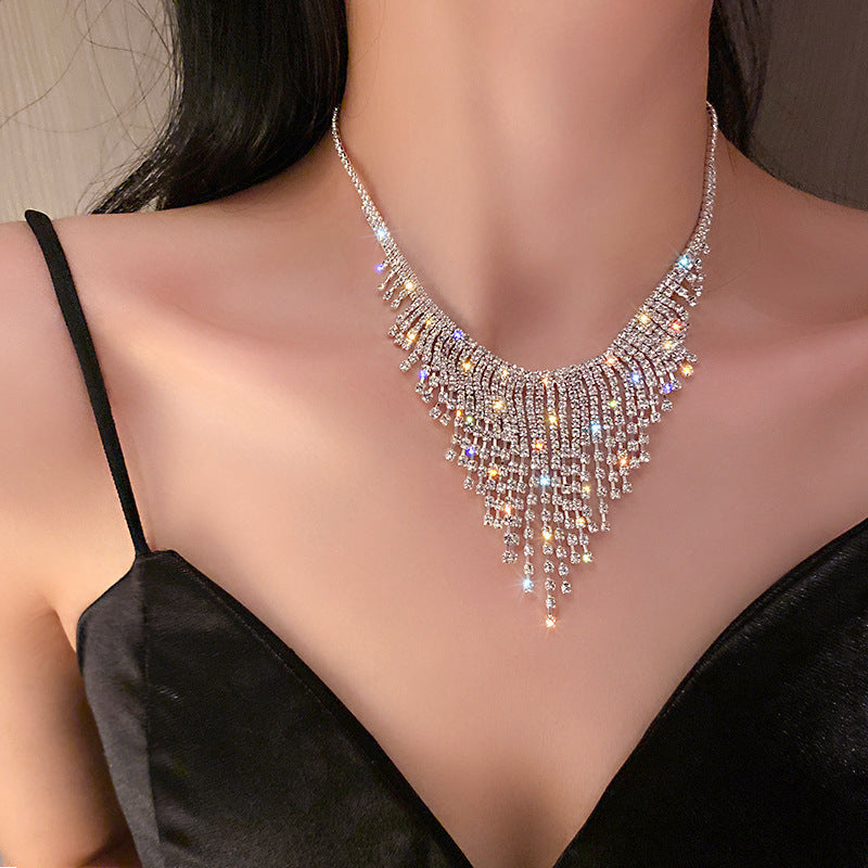 Necklace worn at collarbone length, paired with casual outfit styling