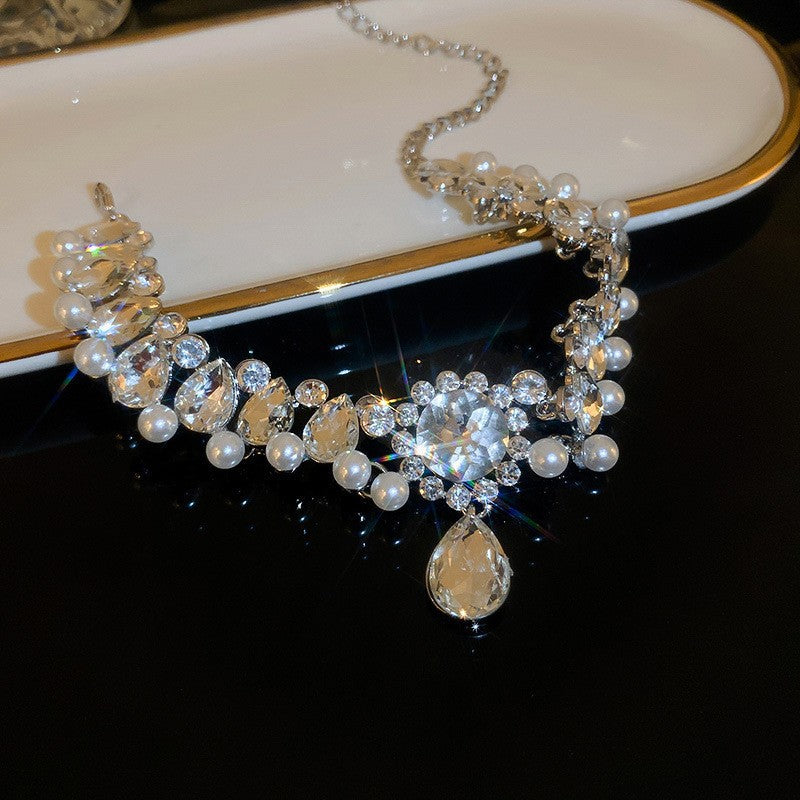 Overhead flat lay displaying full necklace length and clasp mechanism