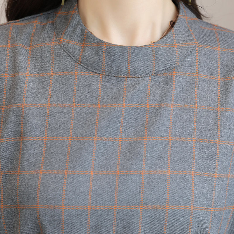 Back view of long sleeve dress showing elegant draping and modest hemline