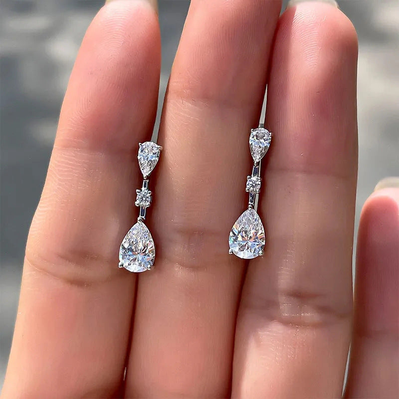 Side profile view of drop earring demonstrating graceful curved silhouette