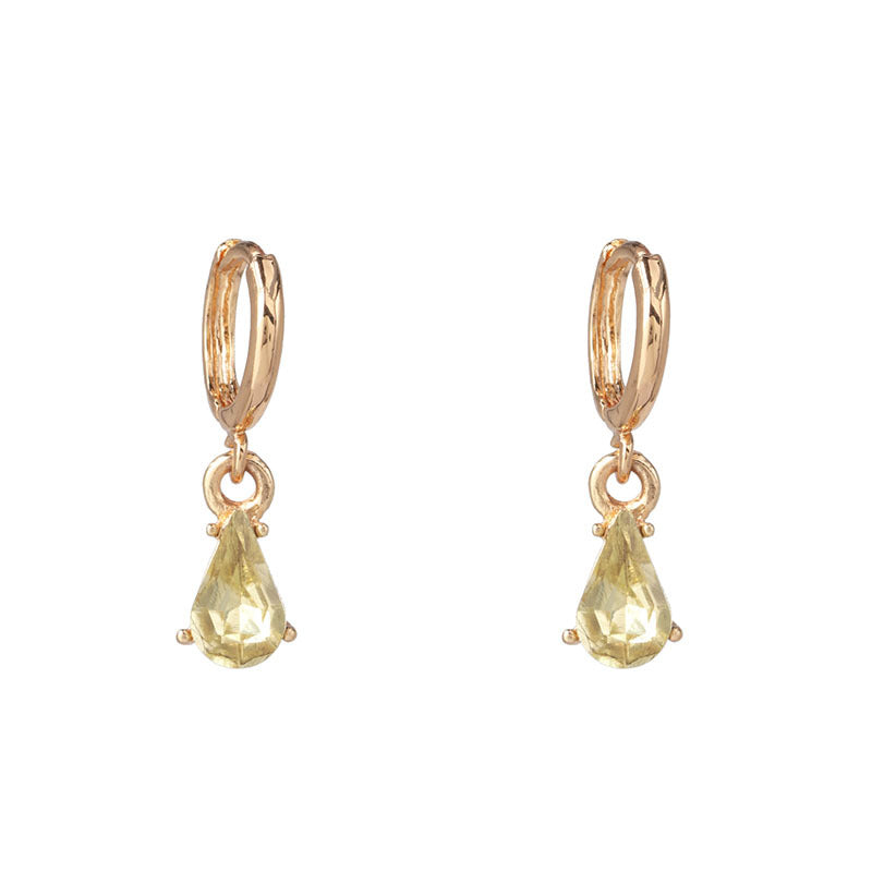 Gold glitter earrings displayed individually showing light reflection detail