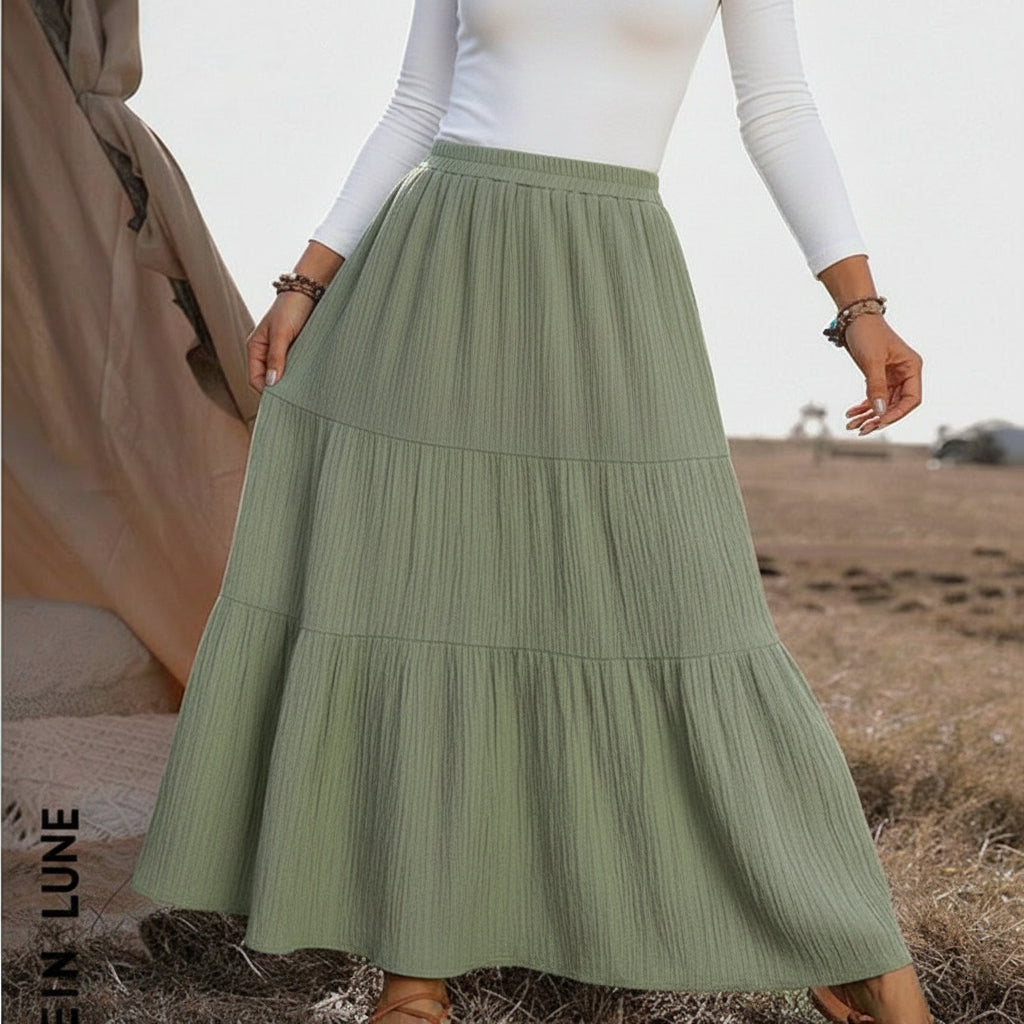 Back view of tiered maxi skirt displaying full silhouette and hem