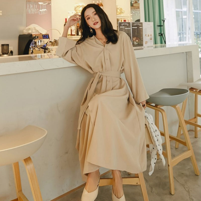 Front view of dress worn, showing complete silhouette from shoulders to feet
