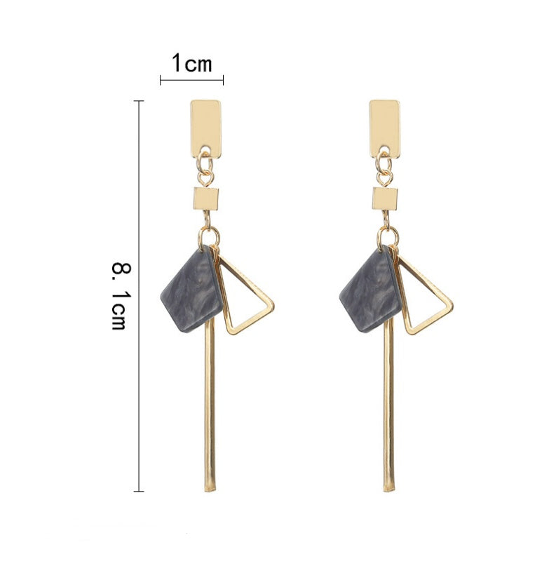 Close-up detail of triangular shapes and clean lines on earring surface