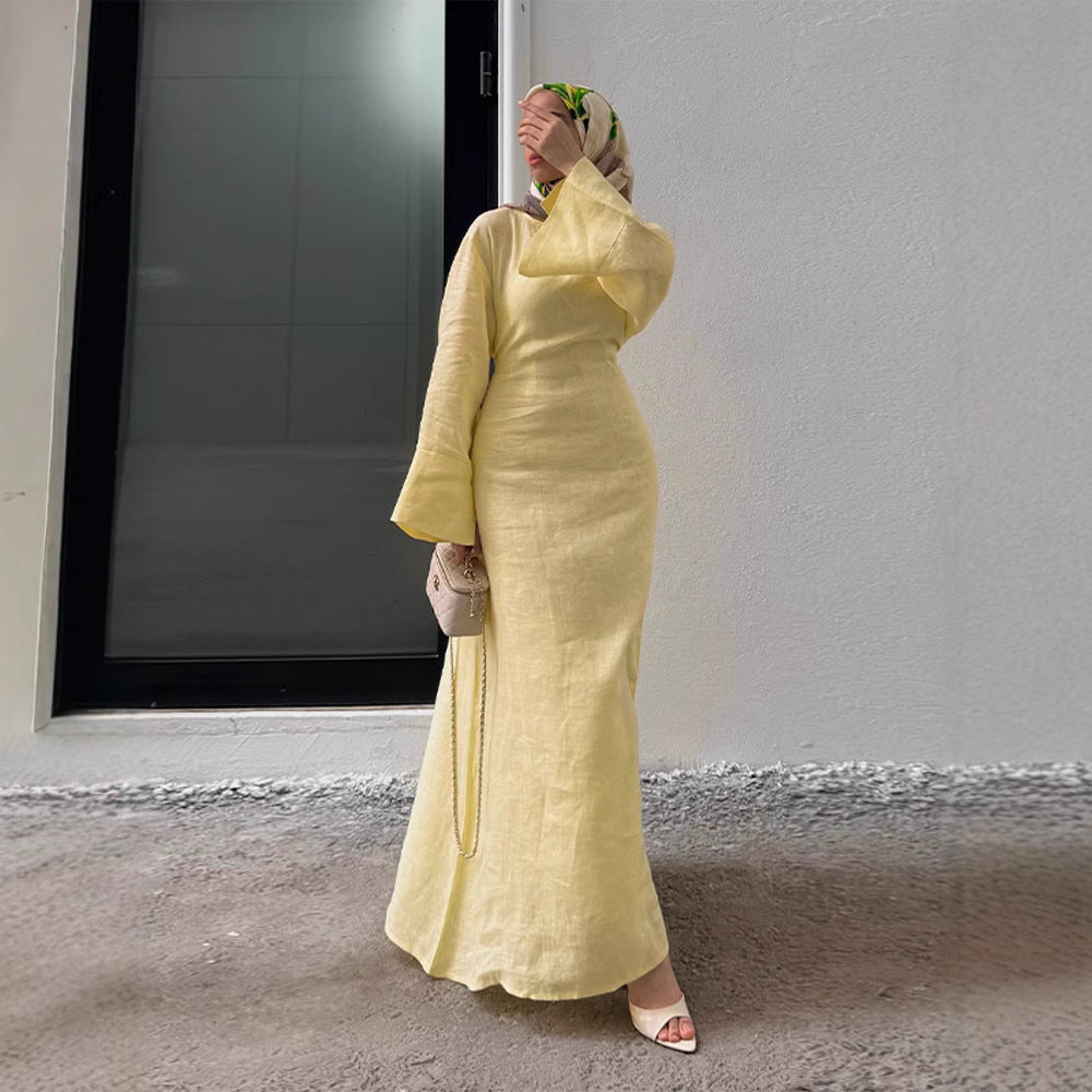 Back view of black long dress showing flowing silhouette and full-length design