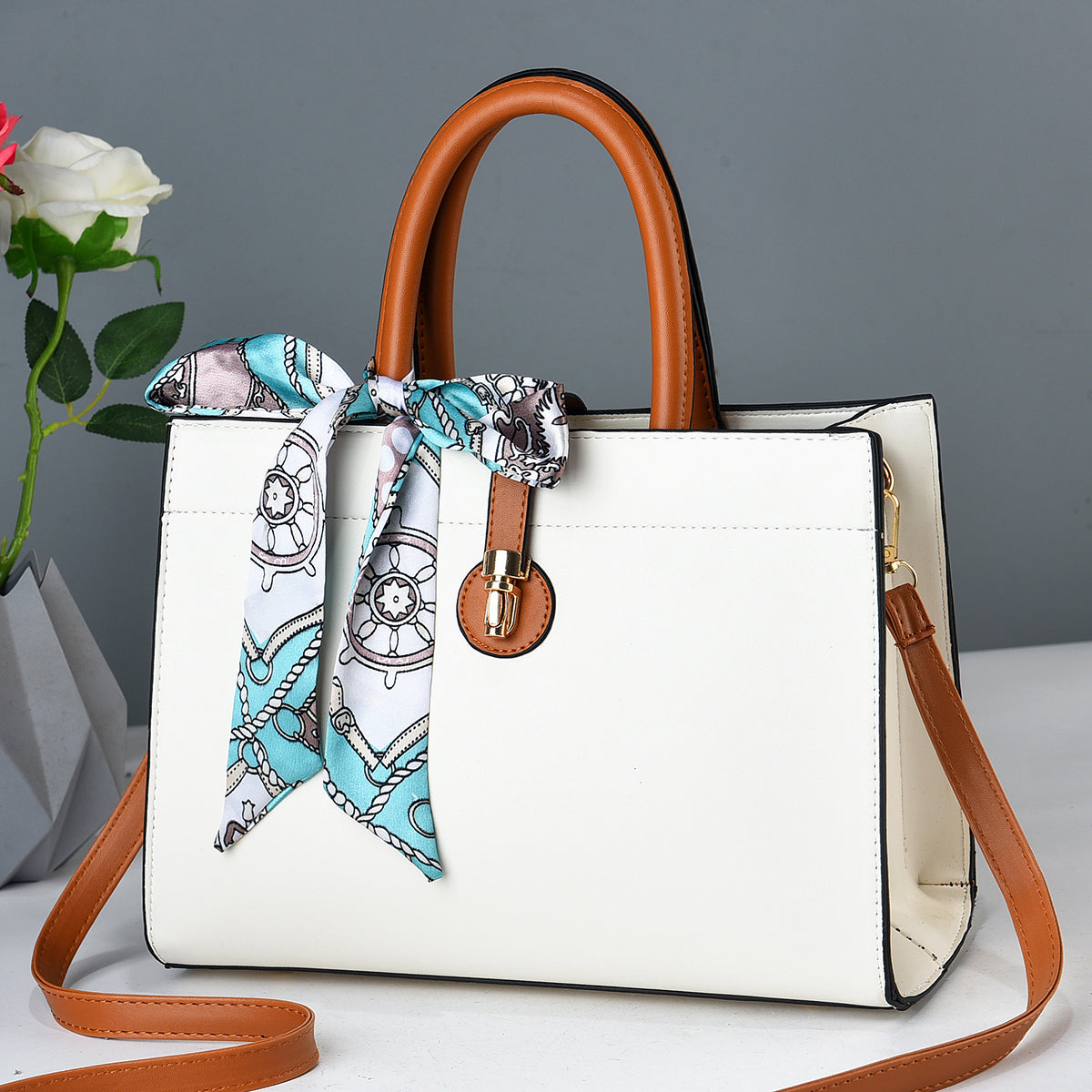 Angled view of tote bag with subtle branding on corner accent