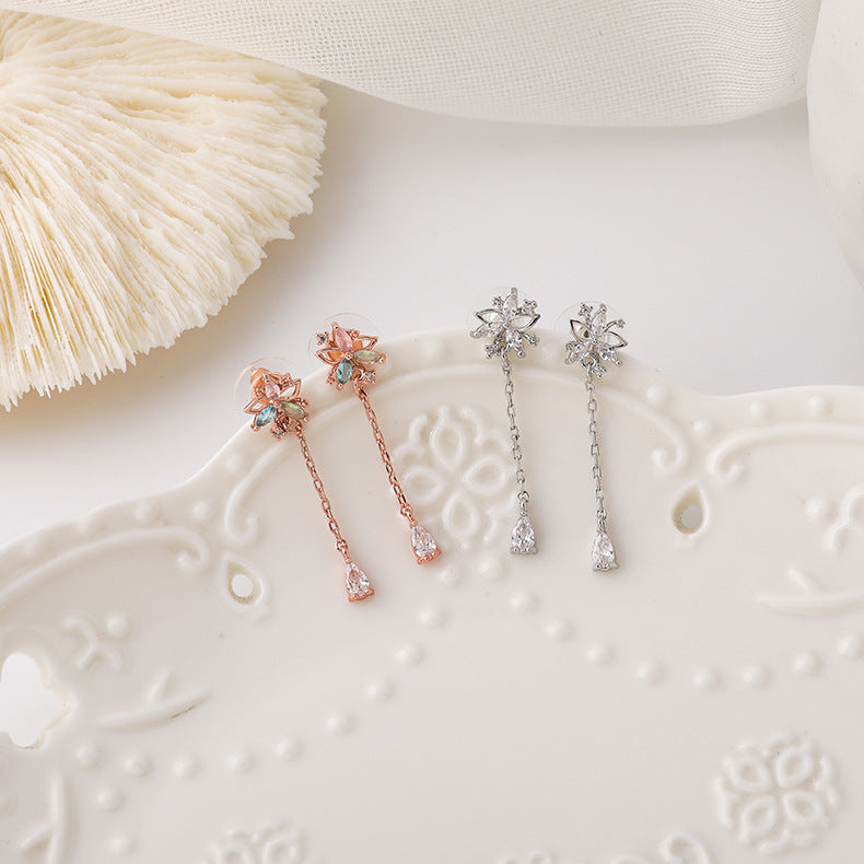 Gold flower tassel earrings with delicate petals and hanging beads, perfect for modest occasions