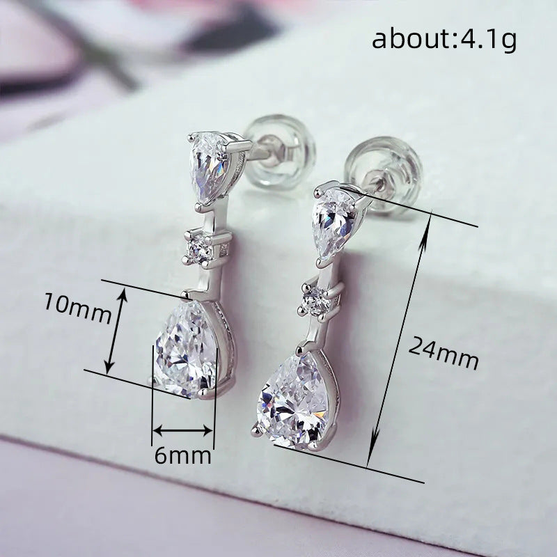 Detail shot of pearl and crystal embellishments on formal occasion earrings