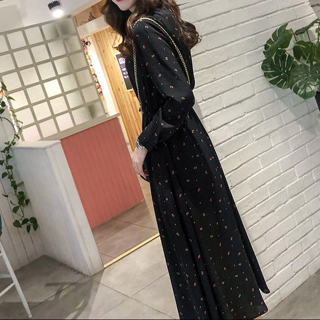 Back view of long sleeve chiffon dress showing modest neckline and flowing skirt