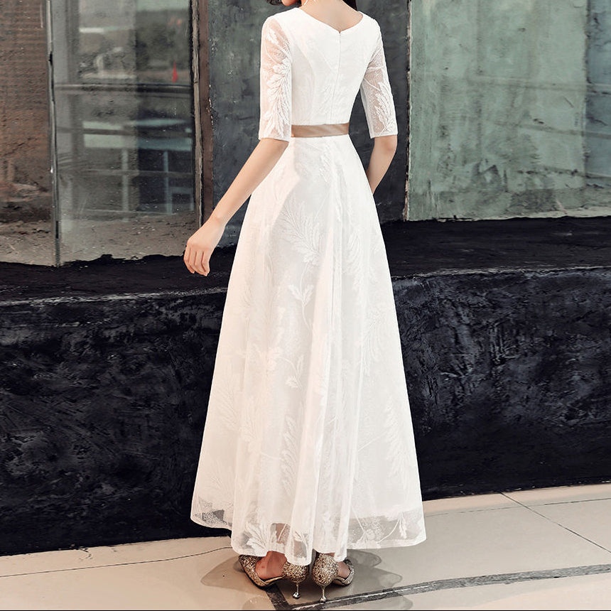 Hem detail showing lace finishing on full-length modest dress