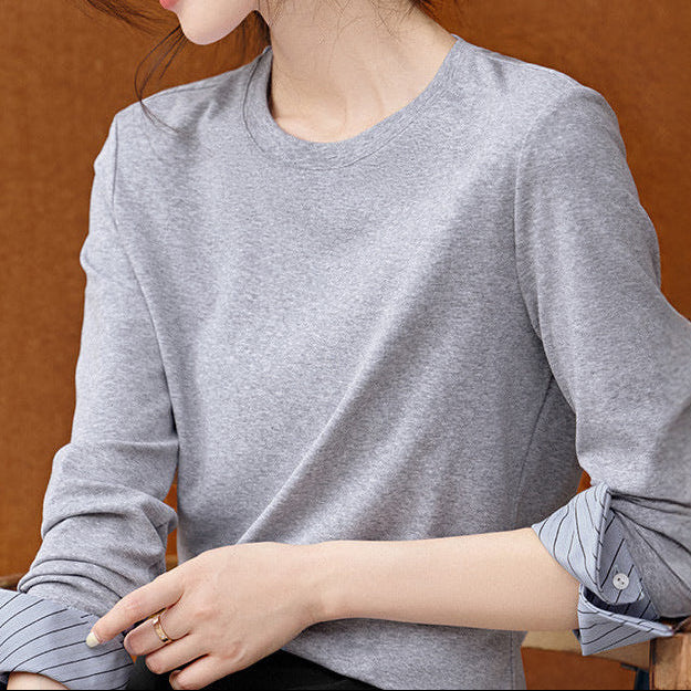 Back view of contrast patchwork striped long sleeve round neck top