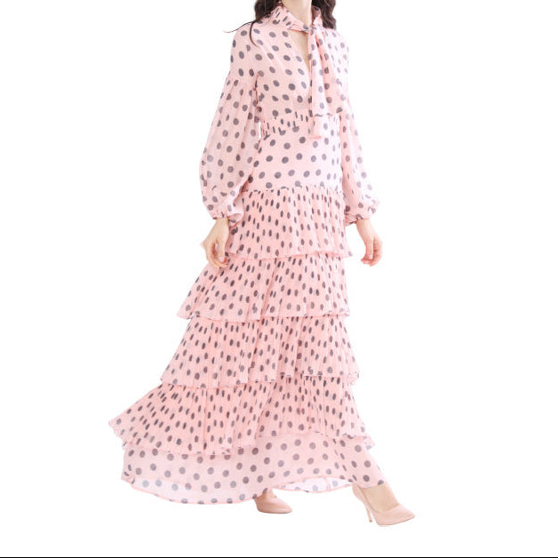 Side profile of chiffon dress displaying drape and fitted waistline design