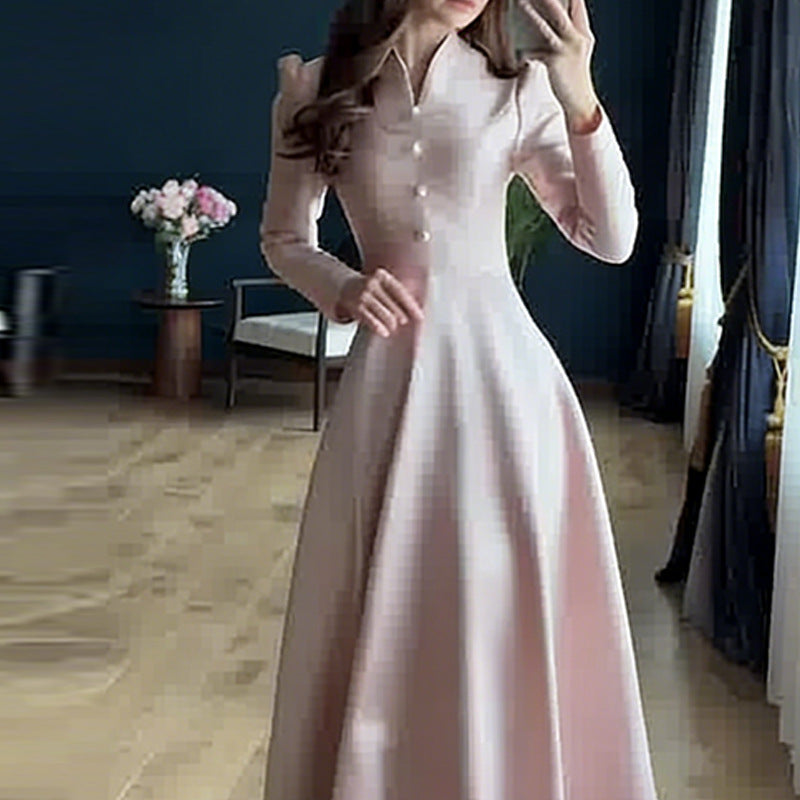Back view of long-sleeve black maxi dress showing minimalist silhouette